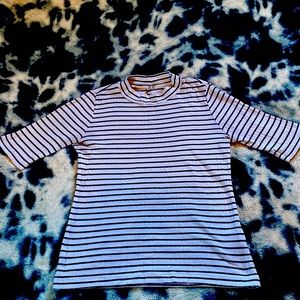Black and white striped, fitted shirt. Made in Indonesia.